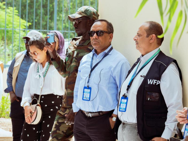 On 4 October 2023 in Senegal, members of the delegation visit a fruit and cereal processing unit in the Mbao Forest where a project to strengthen the socio-economic resilience of market gardening groups has been undertaken. Pictured are H.E. Dr. Mohammed Ahmed Alghamdi, Permanent Representative of the Kingdom of Saudi Arabia to FAO (right); and H.E. Mr. Muhammad Muhith, Vice-President of the Executive Board of UNDP/UNFPA/UNOPS and Permanent Representative of Bangladesh to the United Nations (to his left).