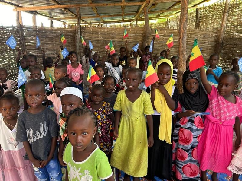 On 4 October 2023, young children sit together in the classroom at a school in the Kolda Region of Senegal, during a visit by members of the delegation on the joint field visit of the Executive Boards of UNICEF, UNDP/UNFPA/UNOPS, WFP and UN Women. The school is jointly supported by WFP and UNICEF and integrates early childhood development, agriculture, nutrition and women’s empowerment.
