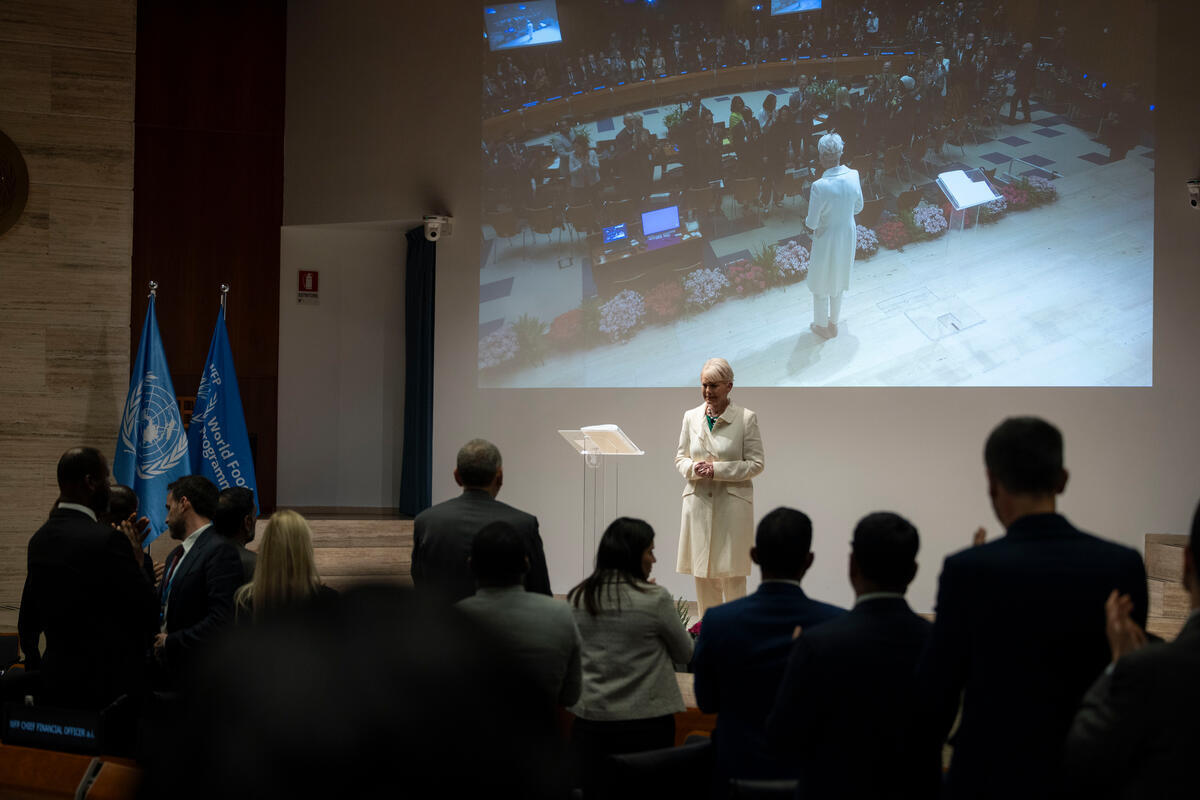 Figure 1 Executive Director Cindy McCain on the Auditorium stage at the close of EB.1/2026, receiving a standing ovation following her announcement to step down. © WFP/Matteo Minnella 